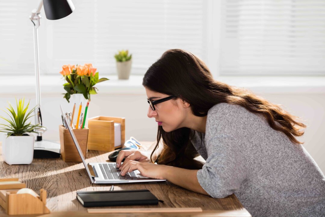 Incorrect postures, such as hunching and slouching, can damage your spine. So what's the correct sitting posture? (Andrey_Popov/Shutterstock)