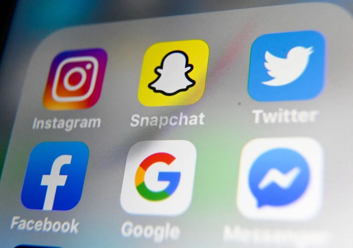The logos of mobile apps Instagram, Snapchat, Twitter, Facebook, Google, and Messenger displayed on a tablet on Oct. 1, 2019. (AFP via Getty Images/Denis Charlet)