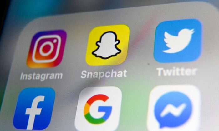 The logos of mobile apps Instagram, Snapchat, Twitter, Facebook, Google, and Messenger displayed on a tablet on Oct. 1, 2019. (AFP via Getty Images/Denis Charlet)