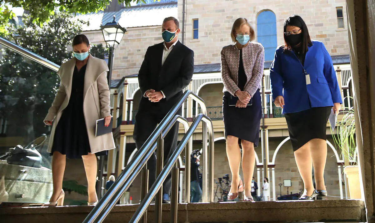 Queensland Health Minister Yvette D'Ath, Deputy Premier Steven Miles, Queensland Chief health officer Jeannette Young and Education minister Grace Grace at Parliament house in Brisbane, Australia on Aug. 6, 2021. (Jono Searle/Getty Images)