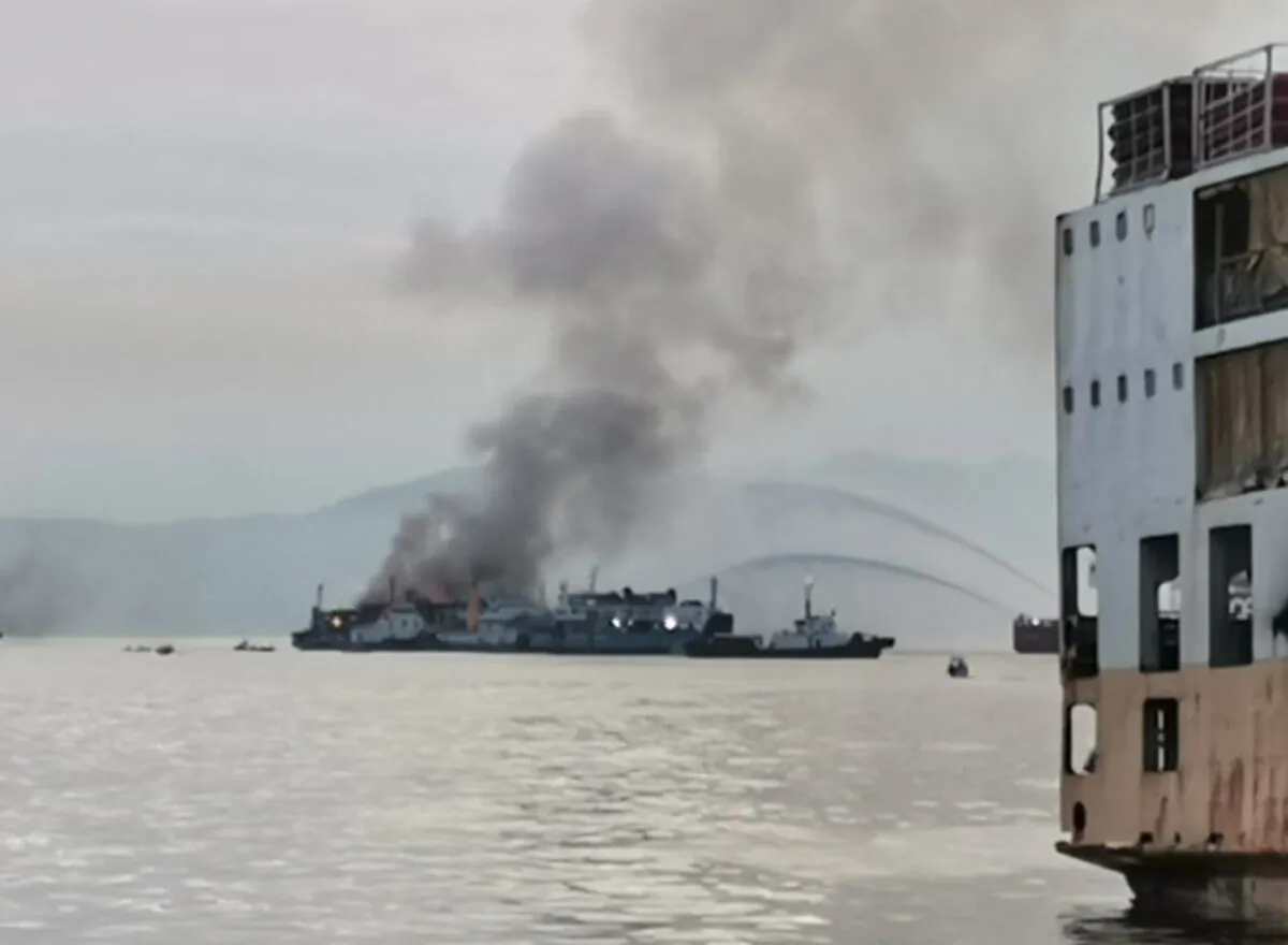 Smoke rises from the M/V Asia Philippines, an inter-island cargo and passenger vessel, as it caught fire while approaching Batangas port, southern Philippines, on Aug. 26, 2022. (Philippine Coast Guard via AP)
