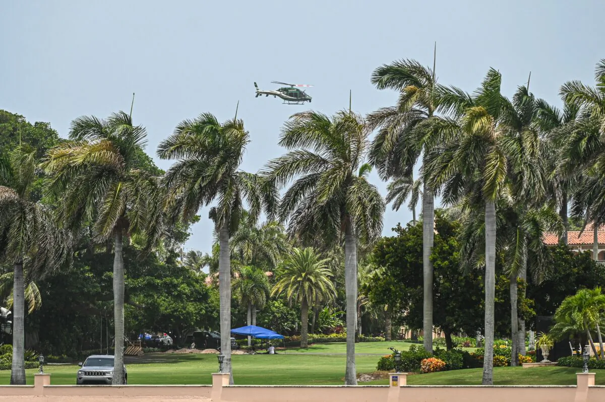 A helicopter flies near the residence of former President Donald Trump in Palm Beach, Fla., on Aug. 9, 2022. (Giorgio Viera/AFP via Getty Images)