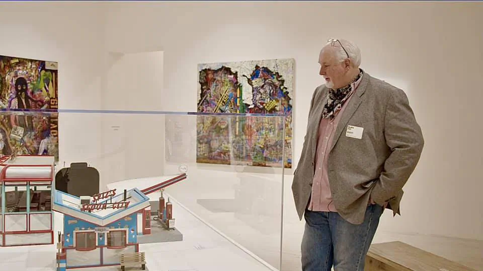 Dean Gillispie, an exonerated Ohio man, peruses some of his prison-created artwork on display at New York's Museum of Modern Art in April 2021. He and independent filmmaker Barry Rowen went there to shoot footage for a documentary about his life. (Photo courtesy of Barry Rowen)