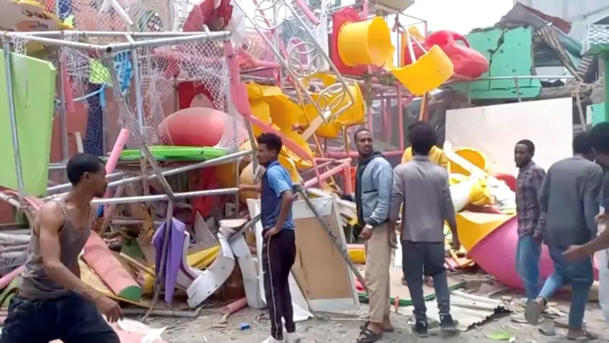 In this still image taken from video, people inspect a damaged playground following an air strike in Mekelle, the capital of Ethiopia's northern Tigray region, on Aug. 26, 2022. (Tigrai TV/Reuters TV via Reuters)