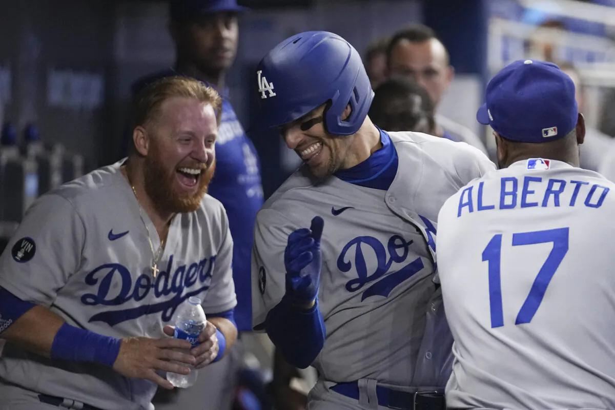 Trayce Thompson (center) of the Los Angeles Dodgers celebrates his solo home run in the second inning against the Miami Marlins at loanDepot Park in Miami, Flor., Aug. 28, 2022. (Eric Espada/Getty Images)