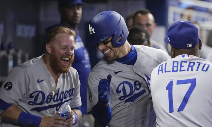 Trayce Thompson (center) of the Los Angeles Dodgers celebrates his solo home run in the second inning against the Miami Marlins at loanDepot Park in Miami, Flor., Aug. 28, 2022. (Eric Espada/Getty Images)