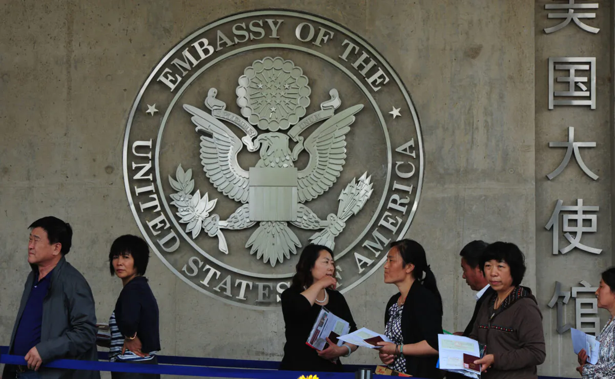 Chinese citizens wait to submit their visa applications at the U.S. Embassy in Beijing on May 2, 2012.( Mark Ralston/AFP/Getty Images)