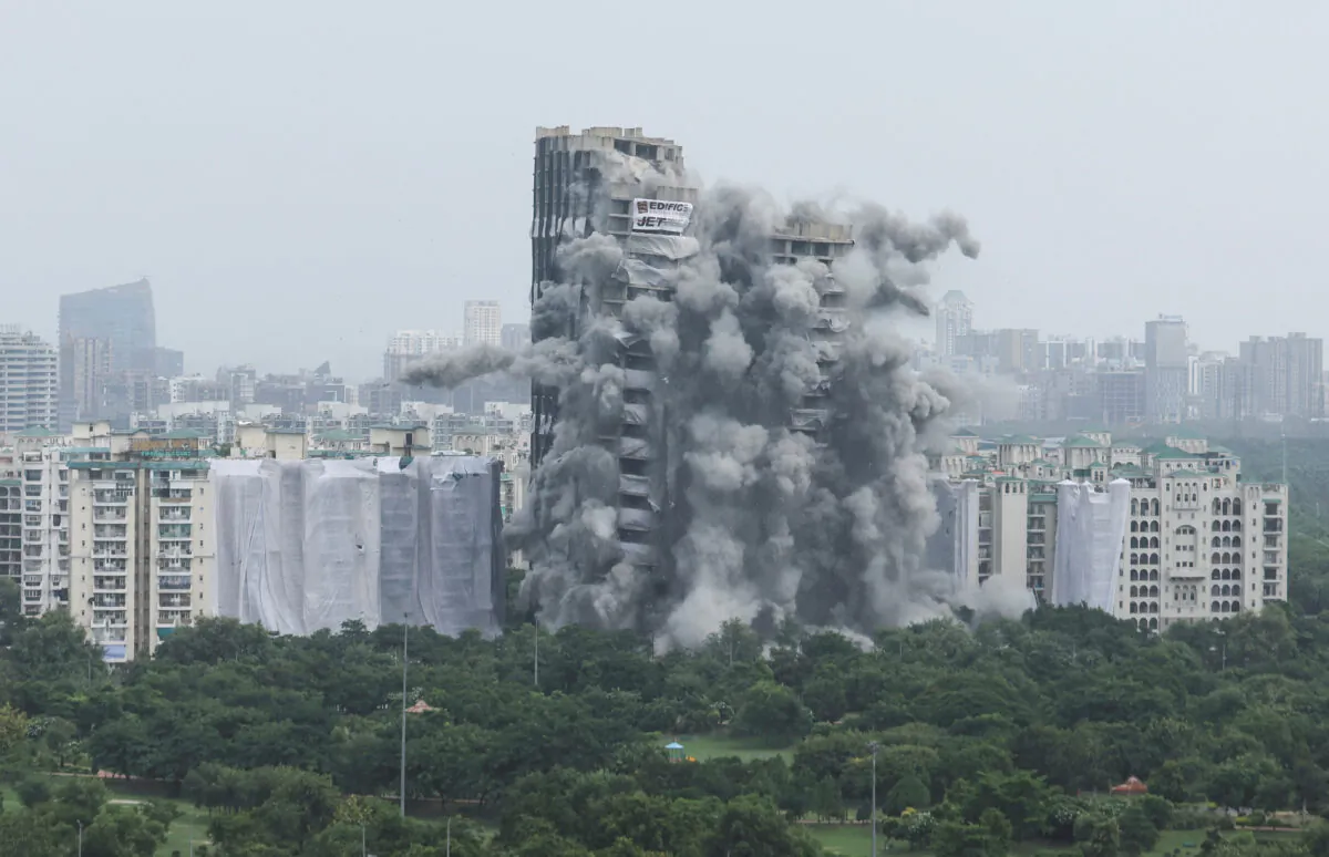 The Supertech Twin Towers collapses following a controlled demolition in Noida, India, on Aug. 28, 2022. (Anushree Fadnavis/Reuters) 