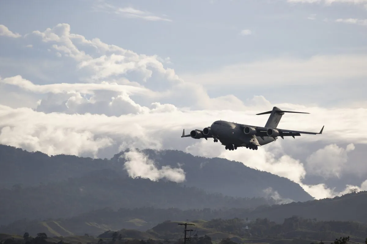 A Royal Australian Air Force C-17 Globemaster aircraft prepares to land at Honiara International Airport in Honiara, Guadalcanal Island, Solomon Islands, on Nov. 30, 2021. (CPL Brandon Grey/Australian Department of Defense via Getty Images)