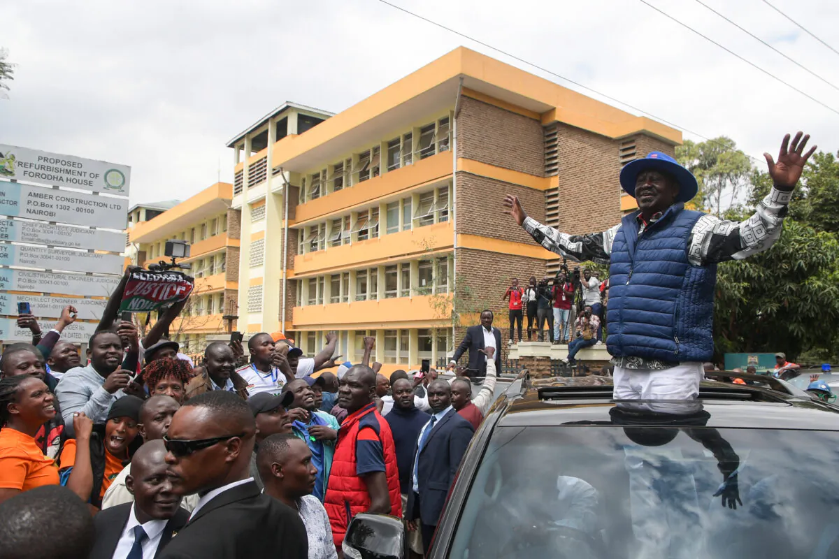 Kenya's Azimio La Umoja Party (One Kenya Coalition Party) presidential candidate Raila Odinga waves to supporters outside the Milimani High Court in Nairobi on Aug. 22, 2022, after filing a petition to the country's top court challenging the result of the Aug. 9, 2022 election that handed victory to his rival William Ruto. (SIMON MAINA/AFP via Getty Images)