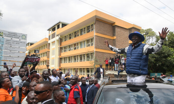 Kenya's Azimio La Umoja Party (One Kenya Coalition Party) presidential candidate Raila Odinga waves to supporters outside the Milimani High Court in Nairobi on Aug. 22, 2022, after filing a petition to the country's top court challenging the result of the Aug. 9, 2022 election that handed victory to his rival William Ruto. (SIMON MAINA/AFP via Getty Images)