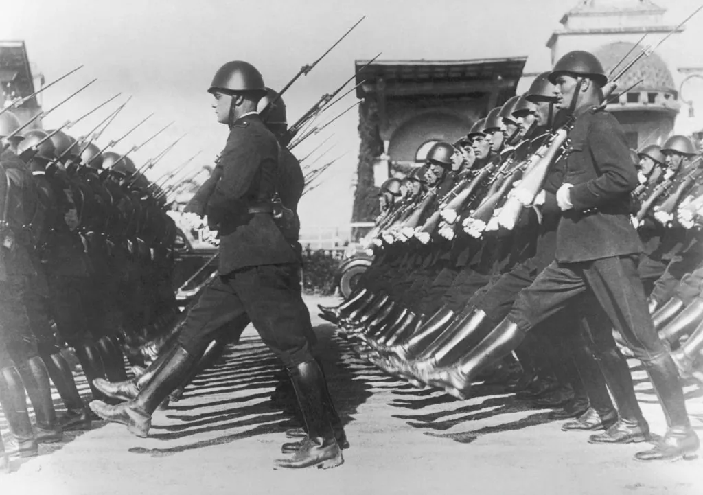 Italian police officers adopt the goose-step (or Passo Romano) for the first time, at a parade marking the 13th anniversary of Mussolini's creation of the metropolitan police force, Rome, on Oct. 17, 1938. (FPG/Hulton Archive/Getty Images)