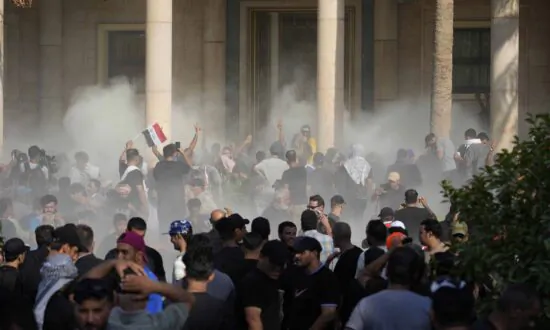 Clashes Erupt After Iraqi Shiite Cleric Resigns, at Least 15 Dead