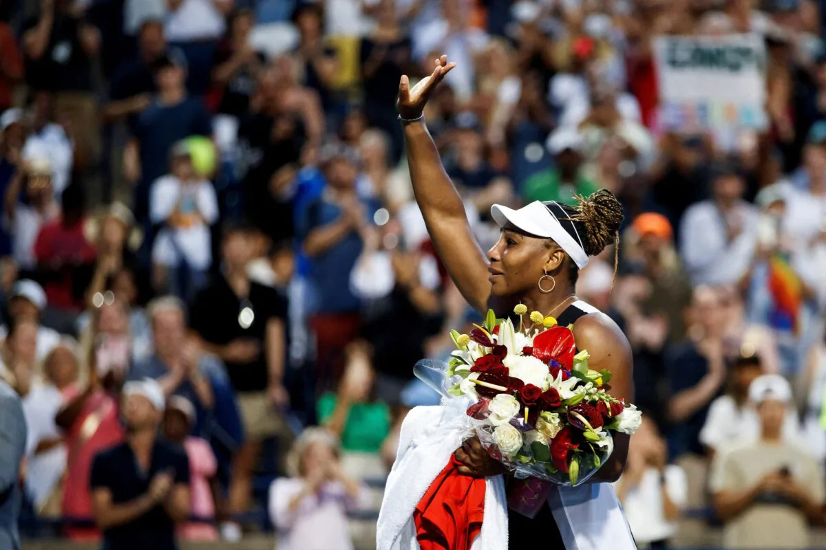 Veteran tennis player Serena Williams waves to the crowd following her loss against Switzerland's Belinda Bencic during the National Bank Open in Toronto on Aug. 10, 2022. (Cole Burston/Reuters)