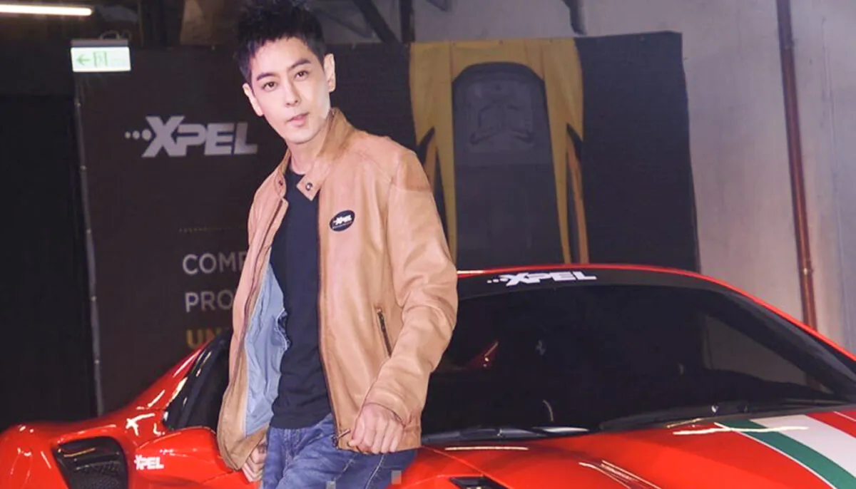Jimmy Lin Chih-ying, a Taiwanese singer, actor and race car driver is pictured in this file photo with one of his favourite race cars. (Huang Tsung-mao/The Epoch Times)