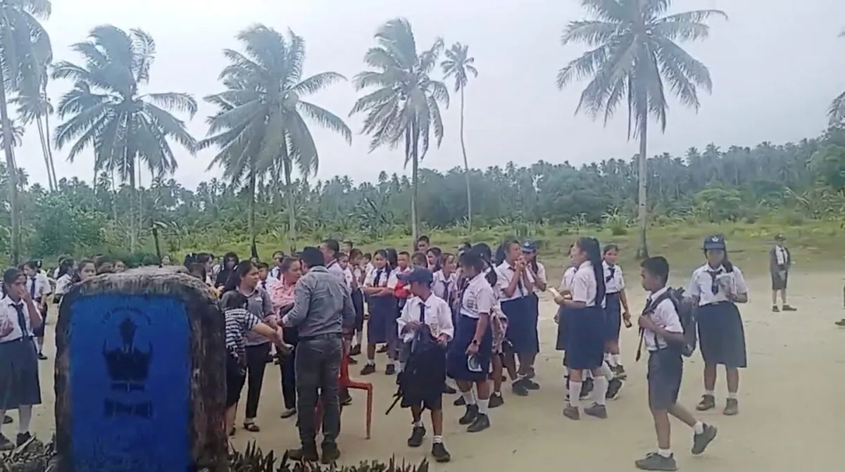 School students and staff gather in an open area after a magnitude 6.4 earthquake struck near Mentawai Islands, in South Nias, North Sumatra, Indonesia, on Aug. 29, 2022, in this screen grab obtained from a social media video. (Facebook/Doniman Aro Harefa/via Reuters)