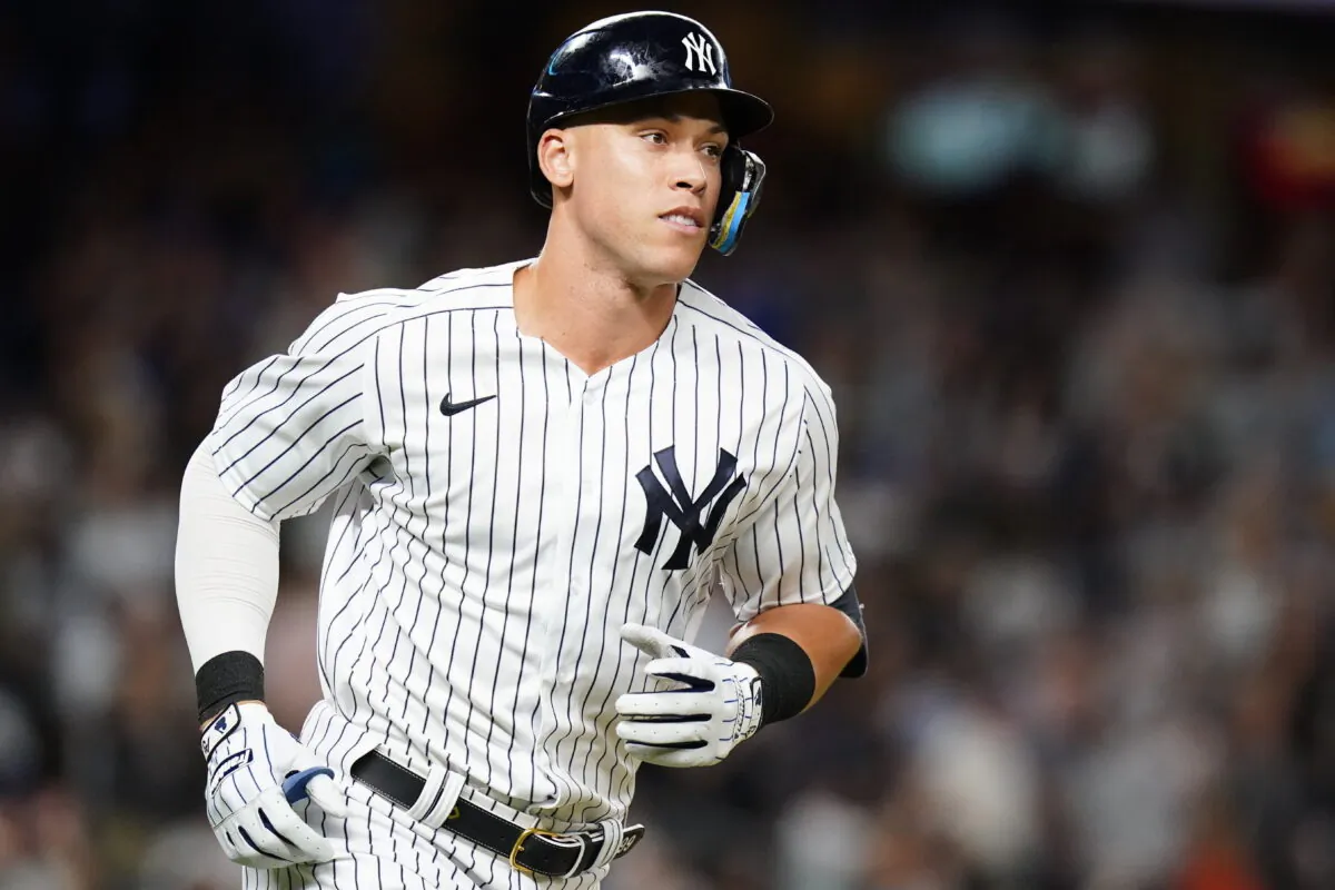 New York Yankees' Aaron Judge smiles as he runs the bases after hitting a home run during the fourth inning of a baseball game against the New York Mets, in New York, on Aug. 23, 2022. (Frank Franklin II/AP Photo)