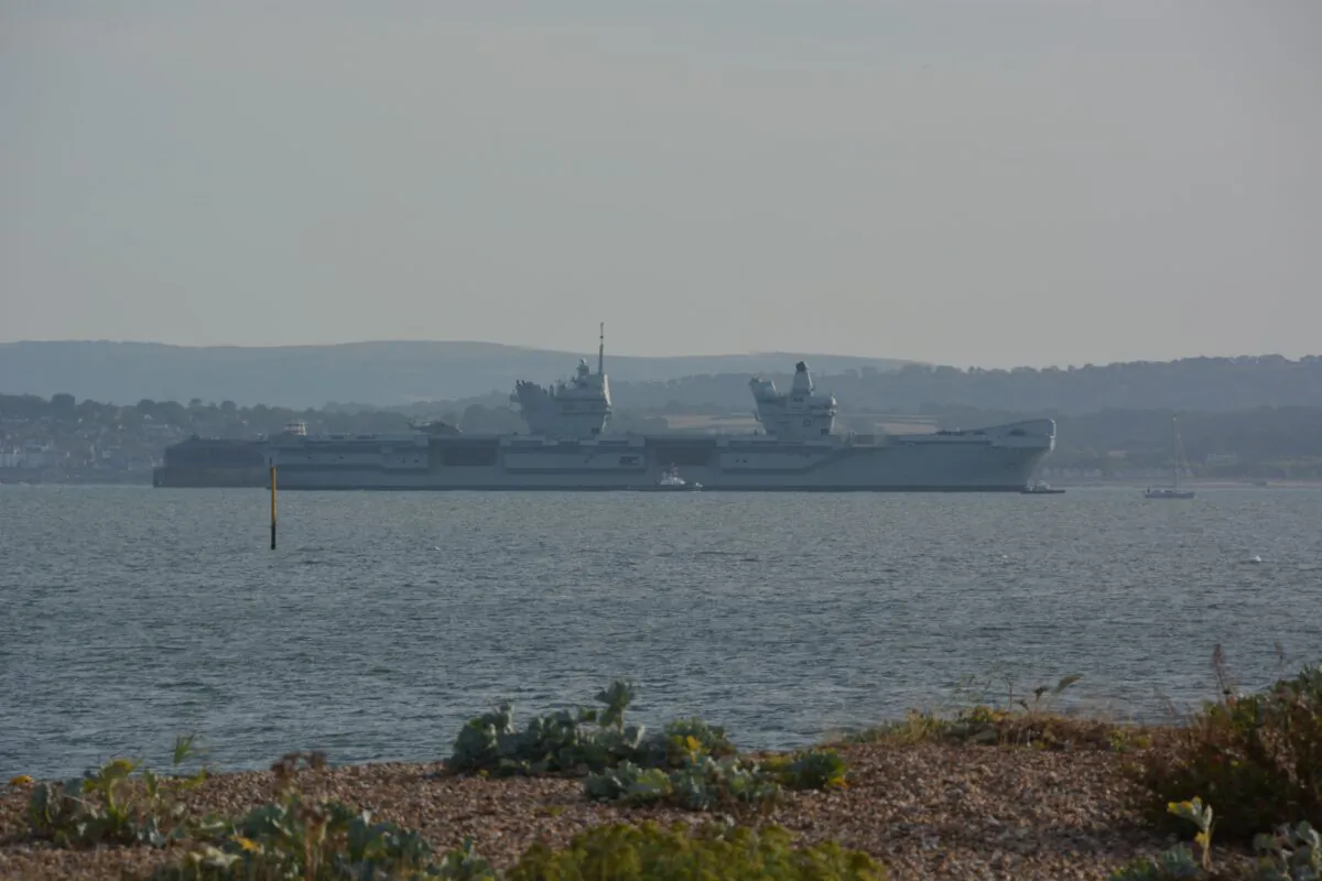 The Royal Navy aircraft carrier HMS Prince of Wales, which broke down off the Isle of Wight, is seen returning to the Solent off Portsmouth, Hampshire, on Aug. 29, 2022. (PA)