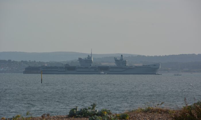 The Royal Navy aircraft carrier HMS Prince of Wales, which broke down off the Isle of Wight, is seen returning to the Solent off Portsmouth, Hampshire, on Aug. 29, 2022. (PA)