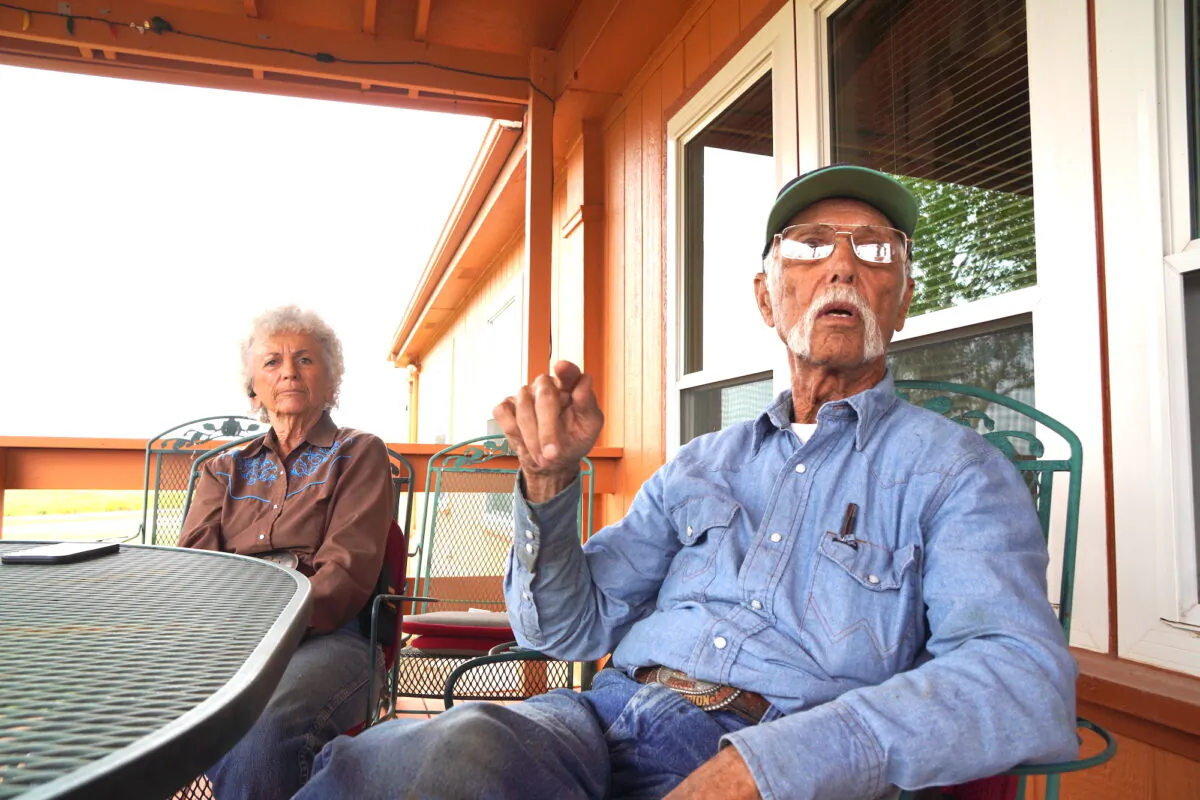 Joe Scelso (R) and his wife Patty (L) say illegal aliens using their property as a way station has gotten worse since Donald Trump left office. (Allan Stein/The Epoch Times)