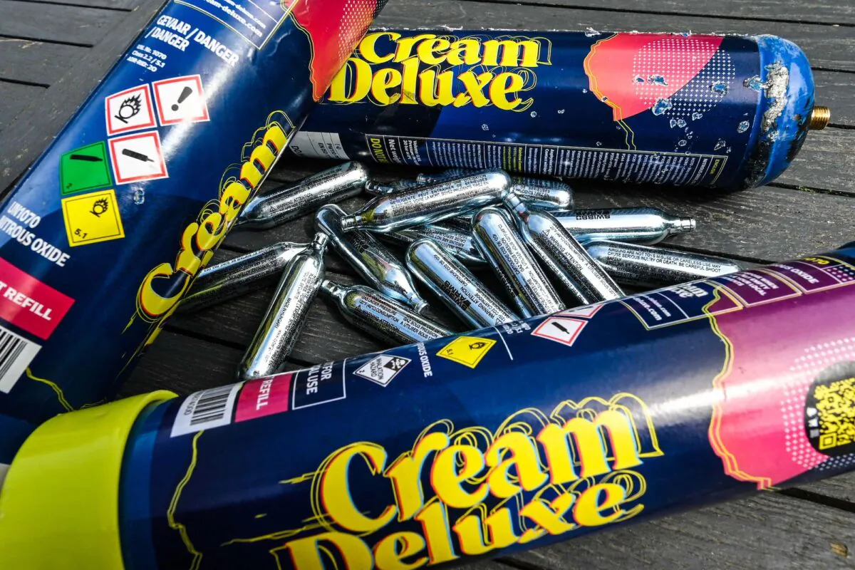 This illustration photograph shows capsules of nitrous oxide, also called "laughing gas," displayed on a table in Lille, France, on May 10, 2022. (Denis Charlet/AFP via Getty Images)