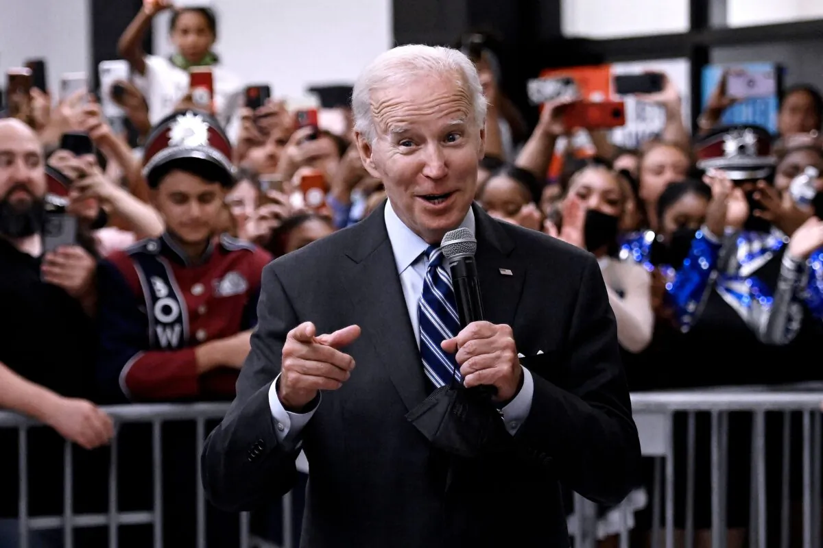 President Joe Biden speaks to people gathered in a cafeteria before a rally for the Democratic National Committee at Richard Montgomery High School in Rockville, Md., on August 25, 2022. (Olivier Douliery/AFP)
