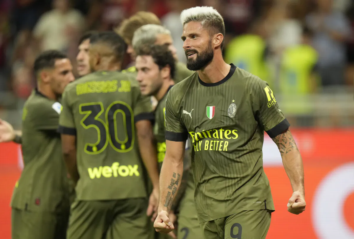 AC Milan's Olivier Giroud celebrates after scoring his side's second goal during a Serie A soccer match between AC Milan and Bologna at the San Siro stadium in Milan, Italy, Aug. 27, 2022. (Luca Bruno/AP Photo)