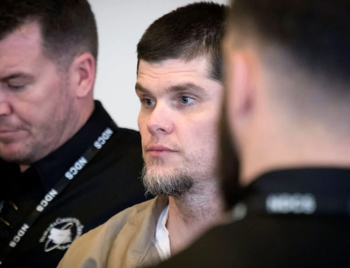 Patrick Schroeder is taken from the courtroom after a hearing on April 19, 2018. (Kent Sievers/Omaha World-Herald via AP)