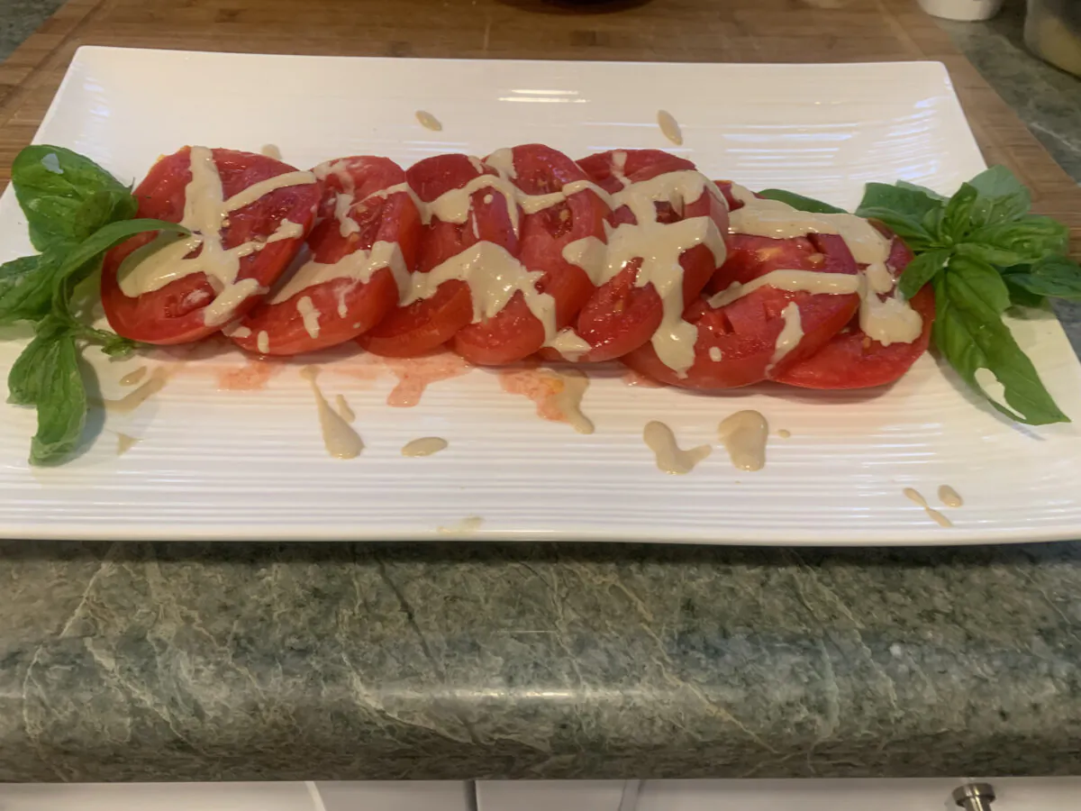 Slightly sweet summer tomatoes drizzled with velvety tonnato sauce. (Diane Rossen Worthington/TNS)