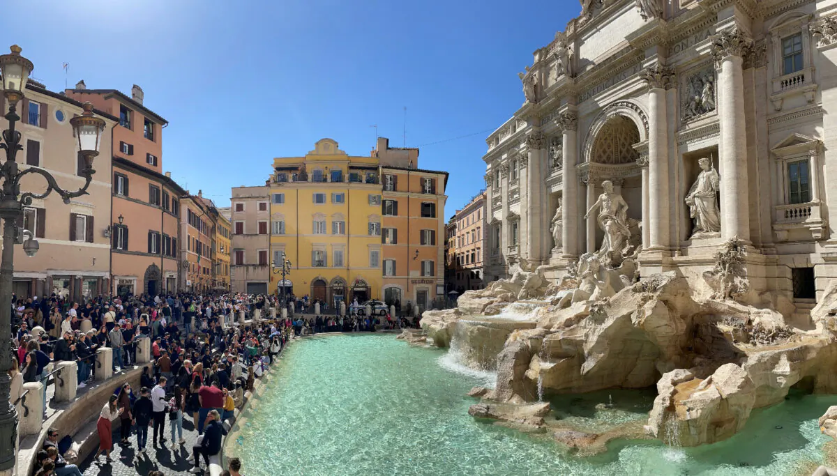 Visitors from around the world toss coins into the Trevi Fountain to ensure their return to the romantic city. (Photo courtesy of David Frederikson.)