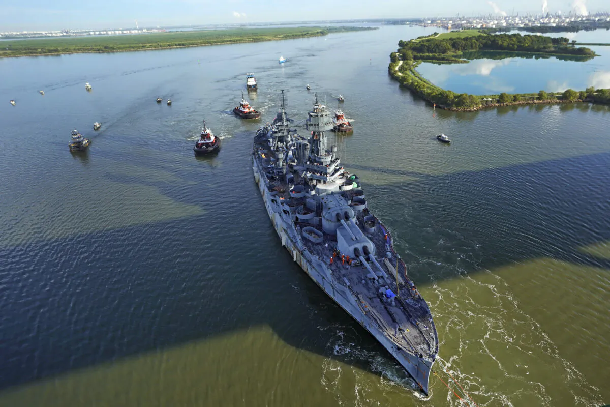 The USS Texas is towed down the Houston Ship Channel Wednesday, Aug. 31, 2022, in Baytown, Texas. (David J. Phillip/AP Photo)