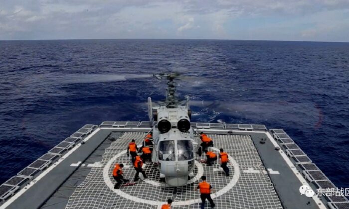A Navy Force helicopter under the Eastern Theatre Command of China's People's Liberation Army (PLA) takes part in military exercises in the waters around Taiwan, at an undisclosed location, on Aug. 8, 2022, in a handout picture released on Aug. 9, 2022. (Eastern Theatre Command/Handout via Reuters)
