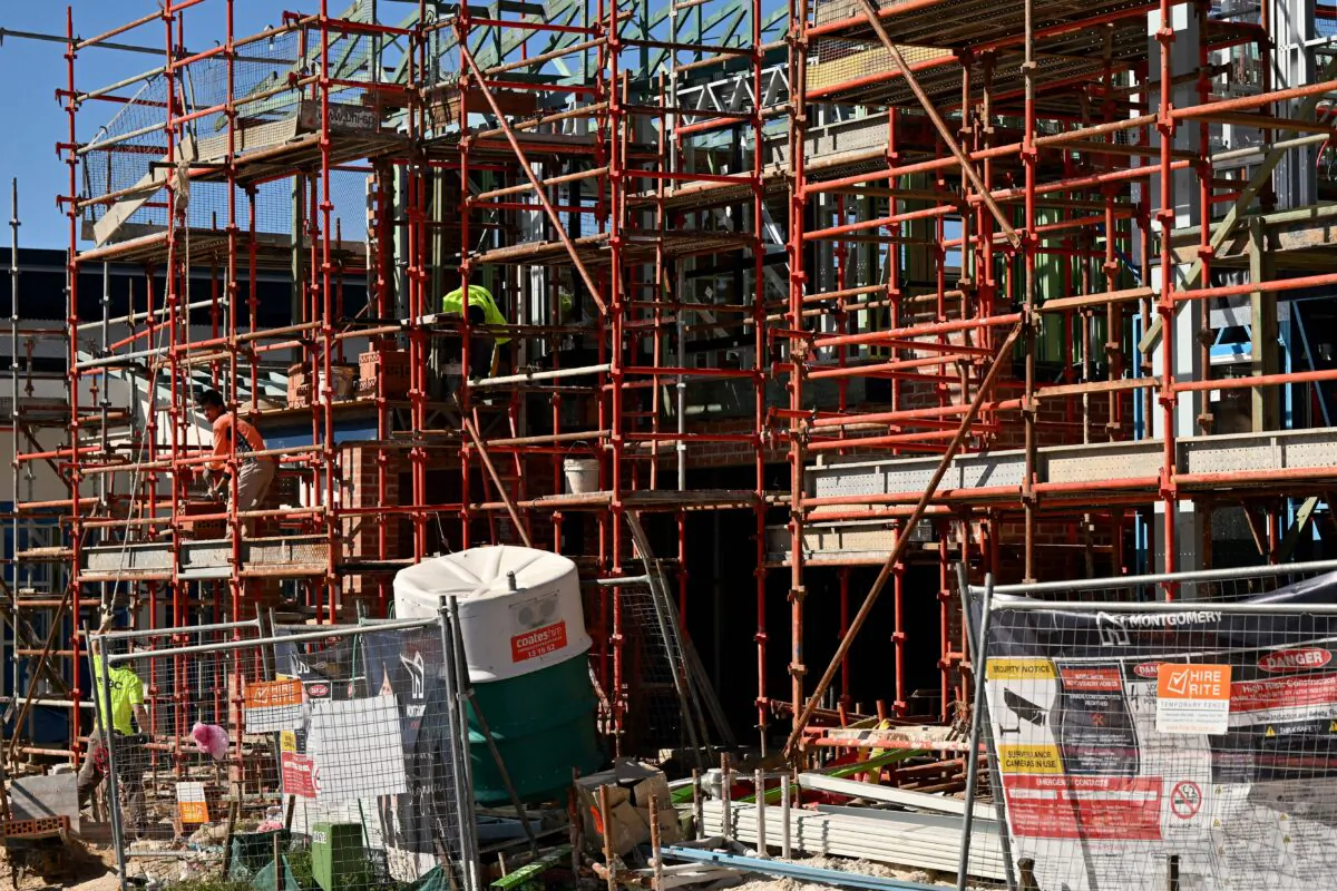 Labourers work on a house under construction in western Sydney, Australia, on Aug. 2, 2022. (Saeed Khan/AFP via Getty Images)