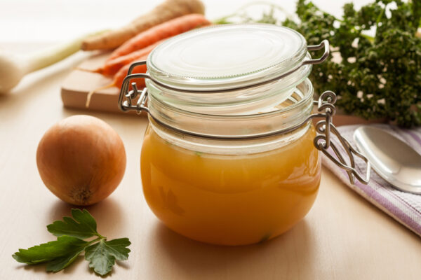Bone,Broth,Made,From,Chicken,In,A,Glass,Jar,,With