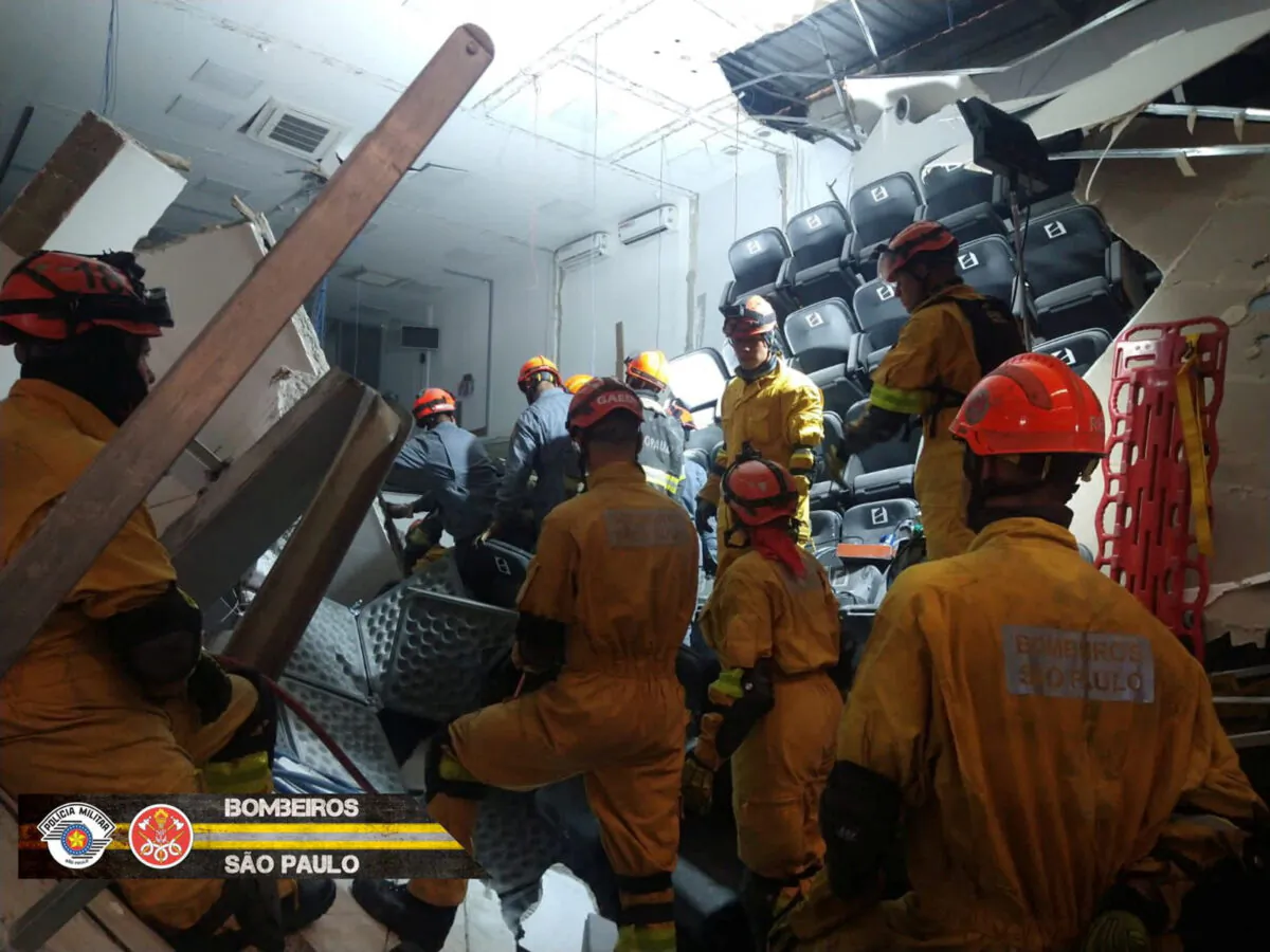 Members of the Fire Department of the State of Sao Paolo work after part of a warehouse collapsed, in Itapecerica da Serra, Sao Paolo, Brazil, on Sept. 20, 2022, in this picture obtained from social media. (Fire Department of the State of Sao Paolo via Reuters)