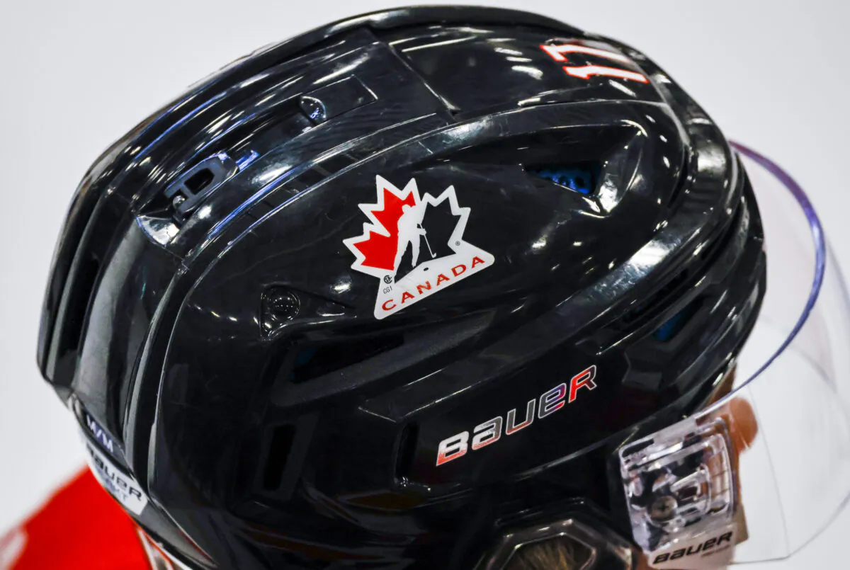 A Hockey Canada logo is visible on the helmet of a national junior team player during a training camp practice in Calgary on Aug. 2, 2022. (The Canadian Press/Jeff McIntosh)