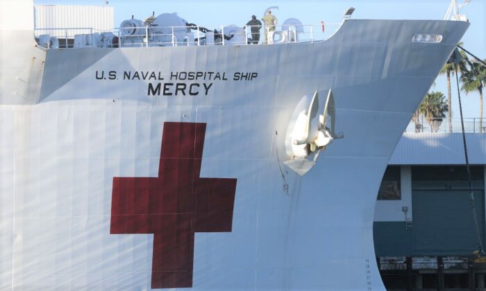 Military personnel stand aboard the USNS Mercy Navy hospital ship docked in the Port of Los Angeles in San Pedro, Calif., on April 15, 2020. (Mario Tama/Getty Images)