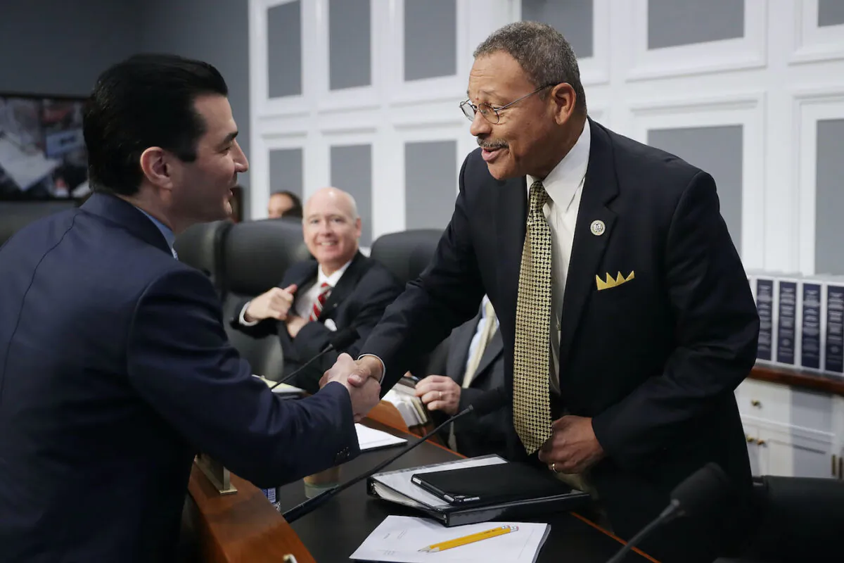 A file image of House Agriculture, Rural Development, Food and Drug Administration and Related Agencies Subcommittee ranking member Rep. Sanford Bishop (D-Ga.) (R) greeting Food and Drug Administration Commissioner Scott Gottleib before a subcommittee hearing in the Rayburn House Office Building on Capitol Hill in Washington, on May 25, 2017. (Chip Somodevilla/Getty Images)