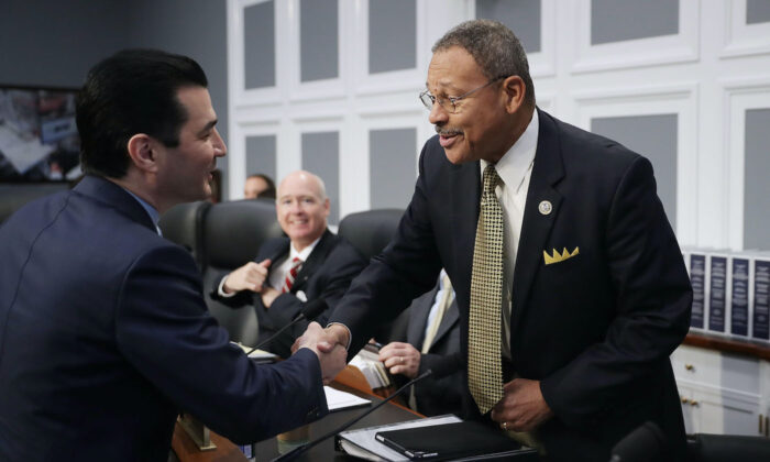 A file image of House Agriculture, Rural Development, Food and Drug Administration and Related Agencies Subcommittee ranking member Rep. Sanford Bishop (D-Ga.) (R) greeting Food and Drug Administration Commissioner Scott Gottleib before a subcommittee hearing in the Rayburn House Office Building on Capitol Hill in Washington, on May 25, 2017. (Chip Somodevilla/Getty Images)