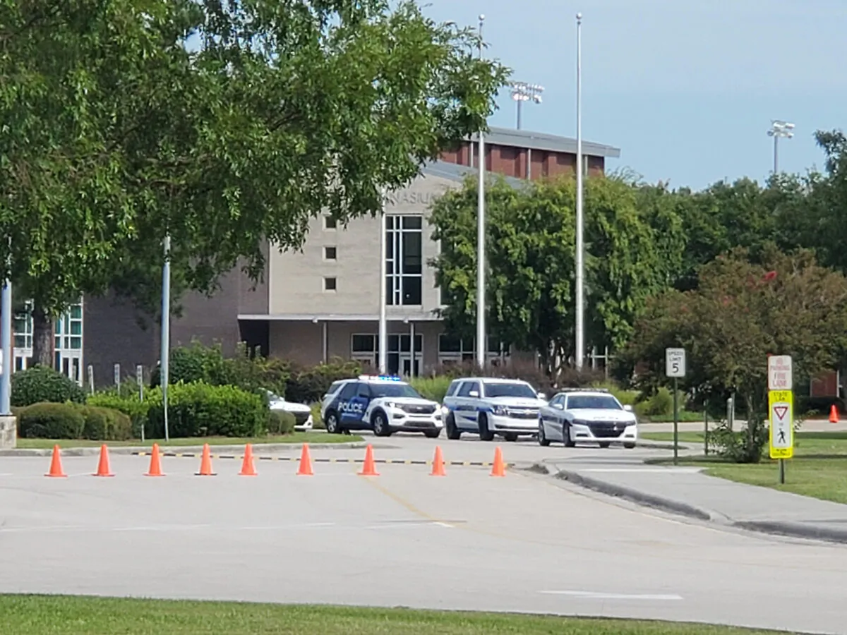 Police cruisers at the site of a fatal stabbing at Northside High School in Jacksonville, N.C., on Sept. 1, 2022. (Trevor Dunnell/The Daily News via AP)