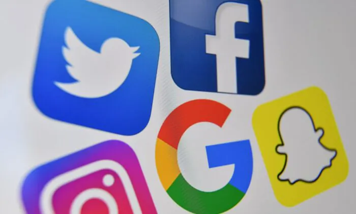 A photo shows the logos of Facebook, Twitter, Instagram, Google, and Snapchat. (Denis Charlet/Getty Images)