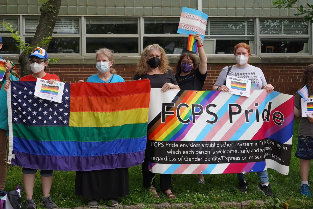 FCPS Pride rally to support Fairfax County Public Schools' (FCPS) pro-transgender policy outside of the Luther Jackson Middle School in Falls Church, Va., on June 16, 2022. (Terri Wu/The Epoch Times)