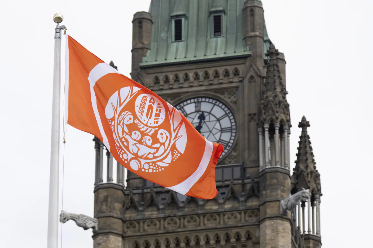The Survivors’ flag flies beside the Peace Tower on Parliament Hill in Ottawa on Aug. 29, 2022. (The Canadian Press/Adrian Wyld)