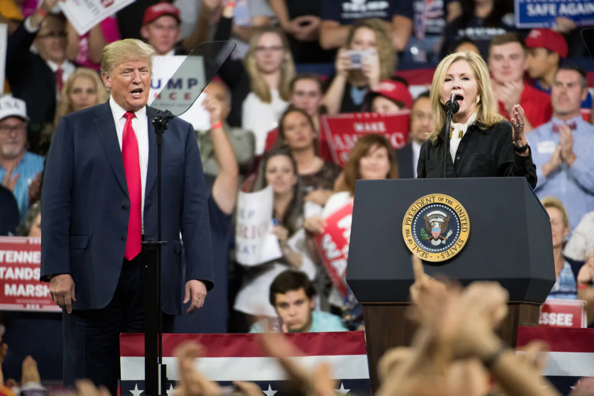 U.S. President Donald Trump and U.S. Rep. Marsha Blackburn (R-Tenn.), who is running for Senate, address the crowd during a campaign rally at Freedom Hall in Johnson City, Tenn., on Oct. 1, 2018. (Sean Rayford/Getty Images)
