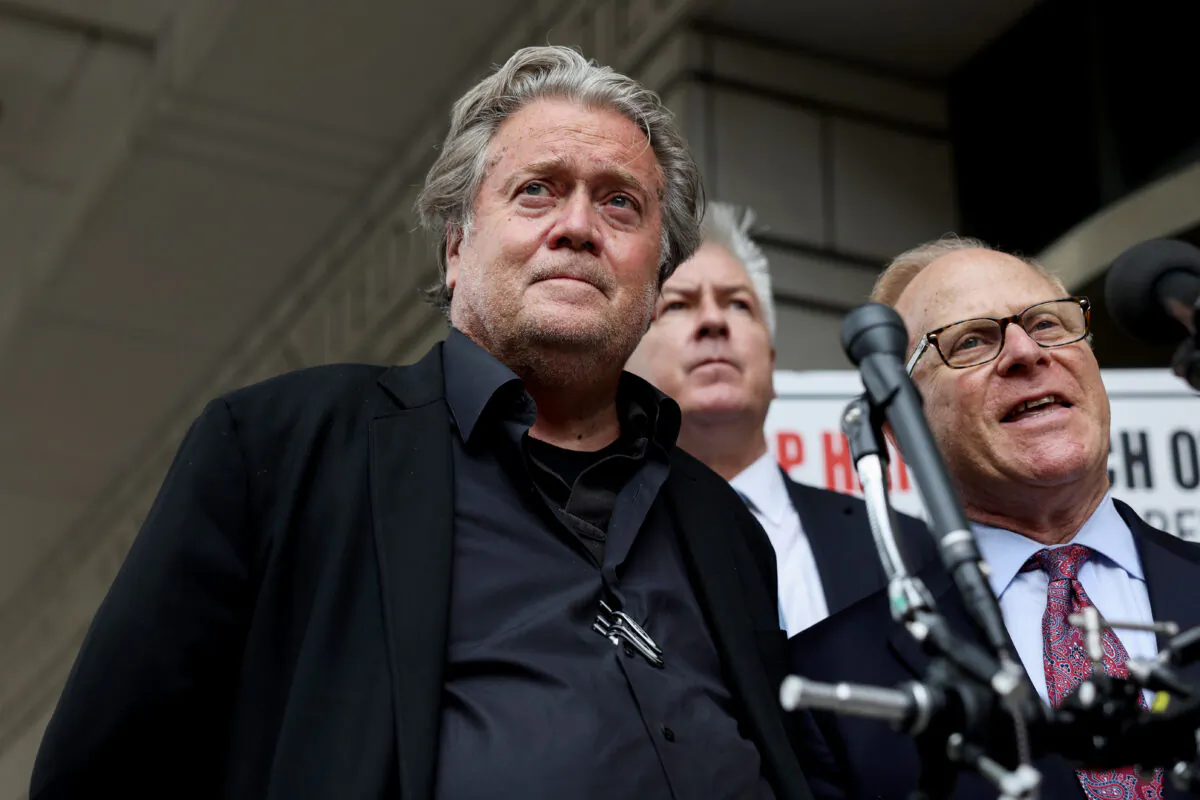 Former White House Chief Strategist Steve Bannon looks on as his attorney David Schoen speaks to reporters as he leaves the Federal District Court House at the end of the fourth day of his trial for contempt of Congress  in Washington, on July 21, 2022. (Anna Moneymaker/Getty Images)