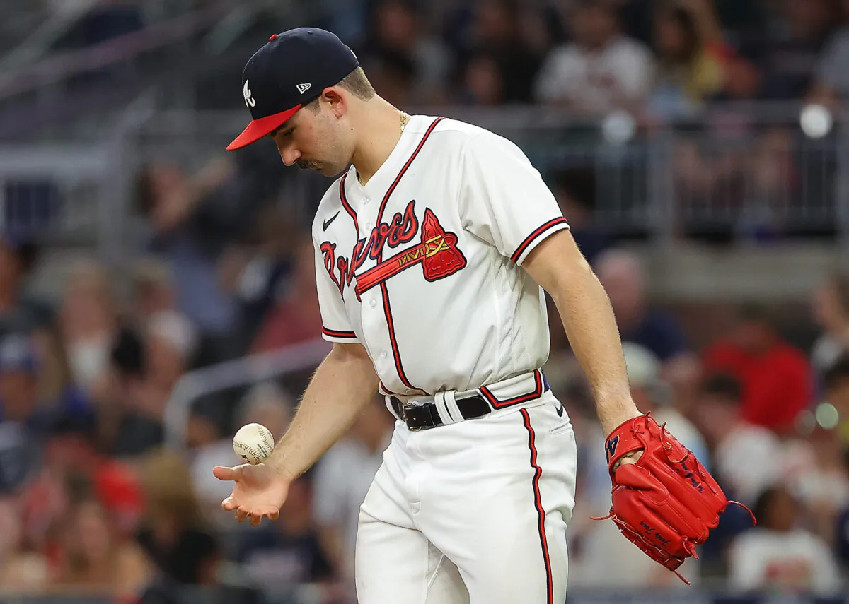 Spencer Strider (65) of the Atlanta Braves picks up the ball as he prepares to warm up before pitching in the eighth inning against the Colorado Rockies at Truist Park in Atlanta on Sept. 1, 2022. (Kevin C. Cox/Getty Images)