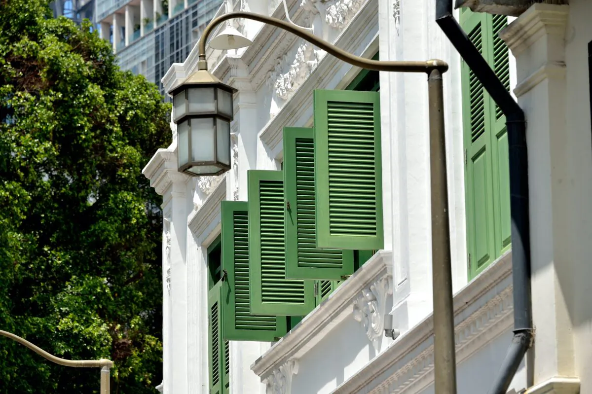 Louvered window shutters add privacy and can also be quite attractive. (Justin Adam Lee/Shutterstock)