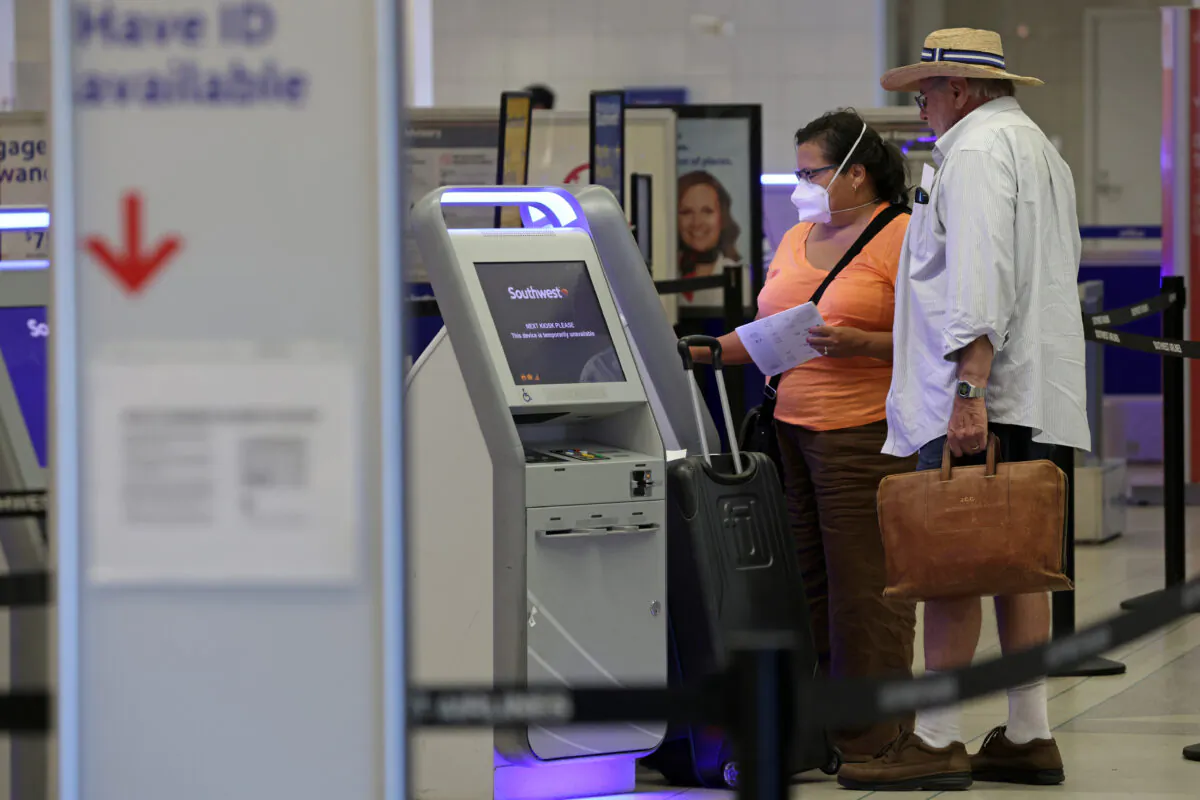 Travelers check themselves in at a kiosk at Philadelphia International Airport on September 2, 2022 in Philadelphia, Pennsylvania. (Alex Wong/Getty Images)