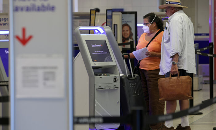 Travelers check themselves in at a kiosk at Philadelphia International Airport on September 2, 2022 in Philadelphia, Pennsylvania. (Alex Wong/Getty Images)