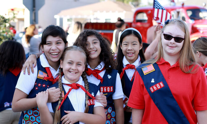 Members of the American Heritage Girls celebrate the joys of girlhood at a recent troop event. The organization is one of many faith-based youth programs benefitting from the loss of membership in the iconic Girls Scout of the USA. (Courtesy of American Heritage Girls)